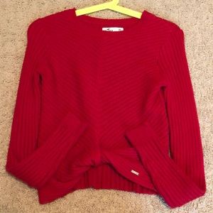 Red long sleeve with a little twist at the bottom